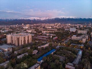 Evening landscape of Almaty city with a view of the mountains
