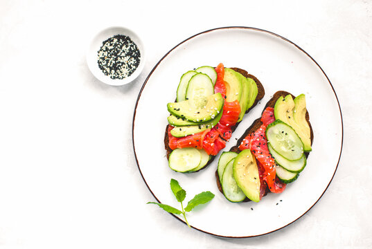 Avocado Salmon Toasts  Served On A Dish, Top Down View