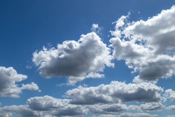 White and grey clouds on a blue sky