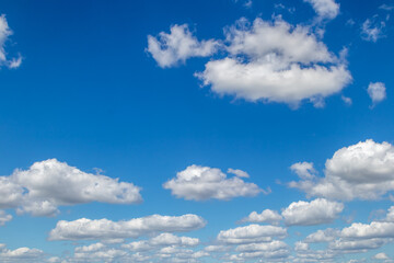 White and grey clouds on a blue sky