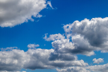 White and grey clouds on a blue sky