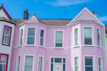 Fototapeta na wymiar Colorful houses red, green, yellow and blue in row in Whitehead, Northern Ireland