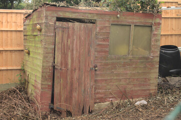 Garden shed in a state of disrepair