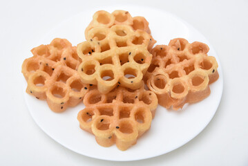 Indian fried snack Achappam or Rosette Cookie is a traditional and popular deep fried snack at tea time Kerala  India during festival christmas, Onam, Vishu. is crunchy, sweet in flower shape