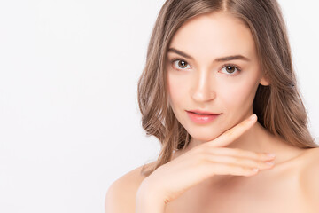 close up Beauty face. Smiling asian woman touching healthy skin portrait. Beautiful happy girl model with fresh glowing hydrated facial skin and natural makeup on white background,