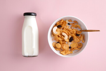 Cereal dessert with corn oat and dry fruits isolated in pink background