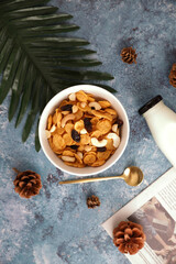 Cereal dessert with corn oat and dry fruits isolated in blue background