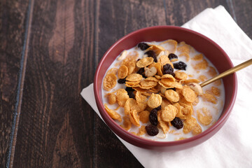 Cereal dessert with corn oat and dry fruits isolated in wood background