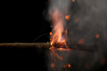 Fuse is burning in the night closeup