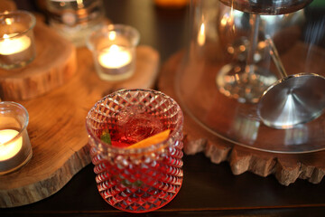 cocktails in glasses on bar counter in pup or restaurant