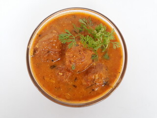 Malai Kofta is a very popular Indian vegetarian dish where balls (kofta) made of potato and paneer are deep fried and served with a creamy and spiced tomato based curry.