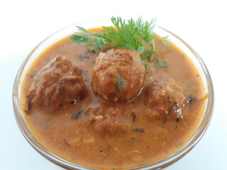 Malai Kofta is a very popular Indian vegetarian dish where balls (kofta) made of potato and paneer are deep fried and served with a creamy and spiced tomato based curry.