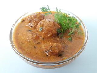 Malai Kofta is a very popular Indian vegetarian dish where balls (kofta) made of potato and paneer are deep fried and served with a creamy and spiced tomato based curry.