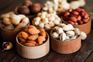 Assorted nuts for a background
Almond, walnut,cashew, pistachios, hazelnuts, peanuts, Macadamia
Collection of different varieties of nuts. Composition with dried fruits
Healthy food. Organic.