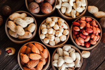 Assorted nuts for a background
Almond, walnut,cashew, pistachios, hazelnuts, peanuts, Macadamia
Collection of different varieties of nuts. Composition with dried fruits
Healthy food. Organic.