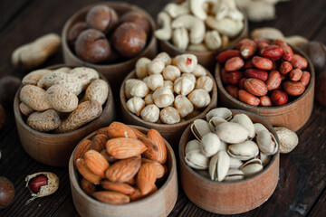 Assorted nuts for a background
Almond, walnut,cashew, pistachios, hazelnuts, peanuts, Macadamia
Collection of different varieties of nuts. Composition with dried fruits
Healthy food. Organic.