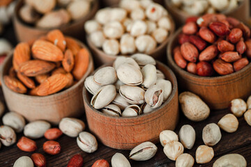 Assorted nuts for a background
Almond, walnut,cashew, pistachios, hazelnuts, peanuts, Macadamia
Collection of different varieties of nuts. Composition with dried fruits
Healthy food. Organic.