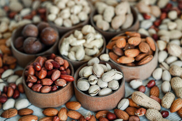 Assorted nuts for a background
Almond, walnut,cashew, pistachios, hazelnuts, peanuts, Macadamia
Collection of different varieties of nuts. Composition with dried fruits
Healthy food. Organic.