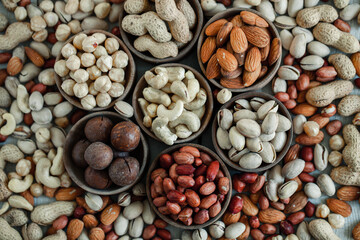 Assorted nuts for a background
Almond, walnut,cashew, pistachios, hazelnuts, peanuts, Macadamia
Collection of different varieties of nuts. Composition with dried fruits
Healthy food. Organic.