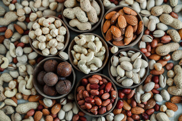 Assorted nuts for a background
Almond, walnut,cashew, pistachios, hazelnuts, peanuts, Macadamia
Collection of different varieties of nuts. Composition with dried fruits
Healthy food. Organic.