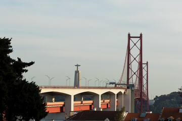 The Christ the King statue monument and 25 April bridge over the Tagus river. Lisbon, Portugal