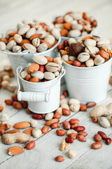 Assorted nuts for a background
Almond, walnut,cashew, pistachios, hazelnuts, peanuts, Macadamia
Collection of different varieties of nuts. Composition with dried fruits
Healthy food. Organic.