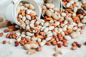 Assorted nuts for a background
Almond, walnut,cashew, pistachios, hazelnuts, peanuts, Macadamia
Collection of different varieties of nuts. Composition with dried fruits
Healthy food. Organic.