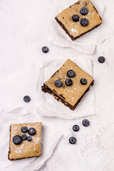 Pieces of Homemade Chocolate Brownies Decorated with Ripe Blueberry on Gray Background Tasty Chocolate Dessert Top View