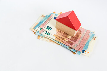 Euro money banknotes with wooden brick home and keys