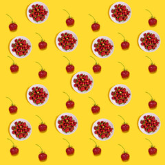 Pattern of strawberries on a yellow background..