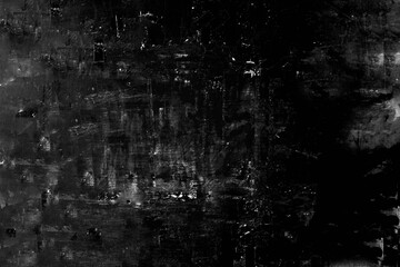 The peeling surface of the concrete wall is aged by time, black in color. Texture or background