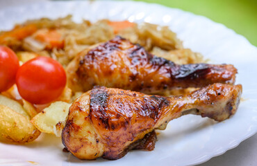 Roasted chicken legs with vegetables