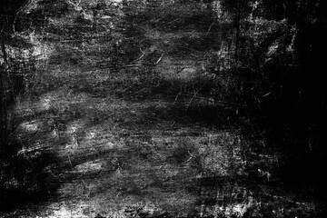 Heavily scratched surface of the stone wall aged by time black color. Texture or background