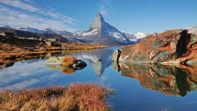 Morning view of Stellisee lake with Matterhorn/Cervino peak on background. Wonderful autumn scene of Swiss Alps, Zermatt resort location, Switzerland, Europe. Full HD video (High Definition).