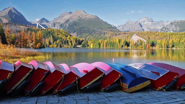 Autumn view of Strbske pleso lake. Picturesque evening scene of High Tatras National Park, Slovakia, Europe. Beauty of nature concept background. Full HD video (High Definition).