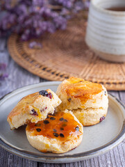 Traditional British scones with a tea cup and blurred background