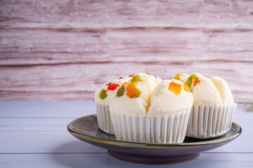 Thai steamed cupcakes topped with dry fruit on plate