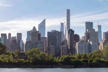 Fototapeta na wymiar Skyscrapers along the East River in the Midtown Manhattan Skyline in New York City with Roosevelt Island