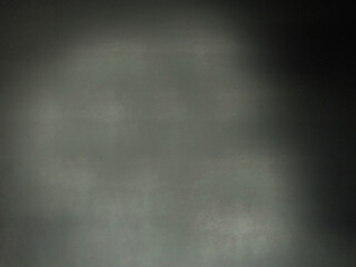 The rough empty surface of the wall is dark gray.Texture or background