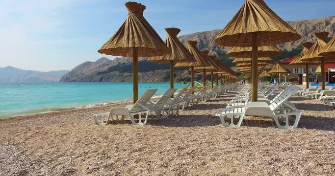 Panoramic morning view of Baska Beach. Bright summer seascape of Adriatic sea, Baska town location, Krk island, Kvarner bay archipelago, Croatia, Europe. 4K video (Ultra High Definition).