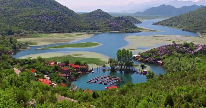 View of  Rijeka Crnojevica river, Skadar lake location. Amazing summer scene of Karuc village, Montenegro, Europe. Beautiful world of Mediterranean countries. Full HD video (High Definition).