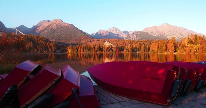 Colorful autumn view of Strbske pleso lake. Splendid evening scene of High Tatras National Park, Slovakia, Europe. Beauty of nature concept background. 4K video (Ultra High Definition)..