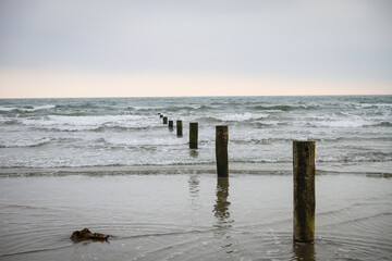 sea defenses or groyens on Newcastle beach in Northern Ireland