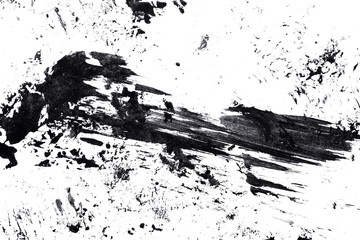 Abstract drops and smears of black acrylic paint isolated on a white background.