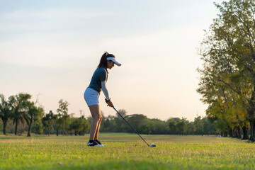 Golfer sport course golf ball fairway. People lifestyle woman playing game golf tee of on the green grass. Asia female player game shot