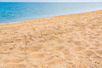 Fototapeta na wymiar White sand beach and alm blue sea