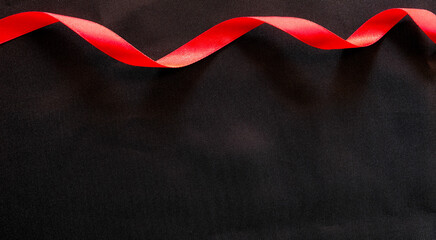 red satin ribbon and black silk texture	