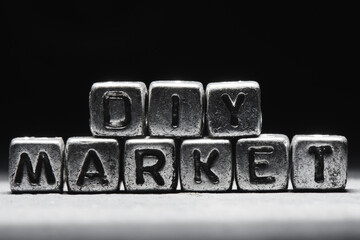 Naklejka premium Inscription DIY market on metal cubes in grunge style on a black темно серый background isolated