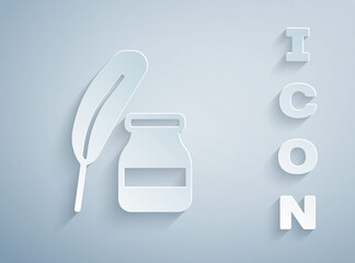 Paper cut Feather and inkwell icon isolated on grey background. Paper art style. Vector.