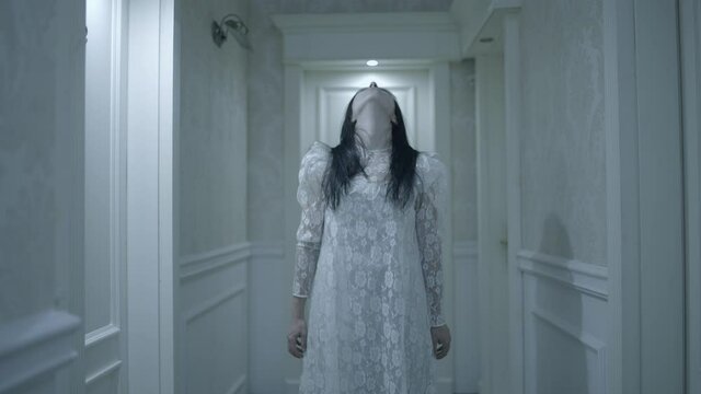 Terrible insane young woman ghost standing in haunted hotel, evil eyes, horror